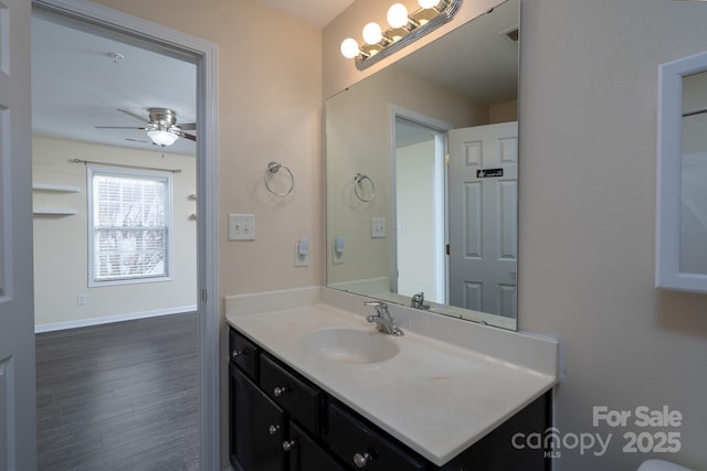 bathroom featuring vanity, wood-type flooring, and ceiling fan