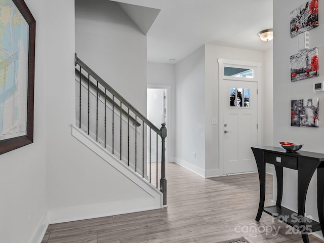 entrance foyer with light hardwood / wood-style floors