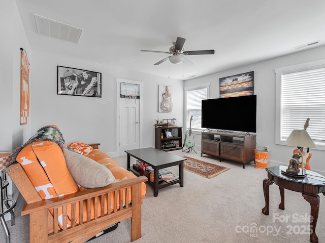 living room with light colored carpet and ceiling fan