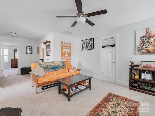 living room with light carpet and ceiling fan