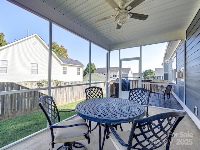 sunroom / solarium with ceiling fan and plenty of natural light