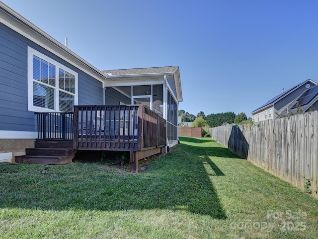 exterior space featuring a wooden deck and a sunroom