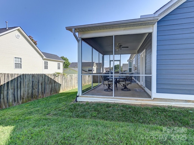 view of yard with ceiling fan and a patio area