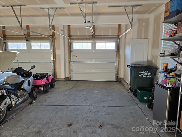 garage featuring a garage door opener