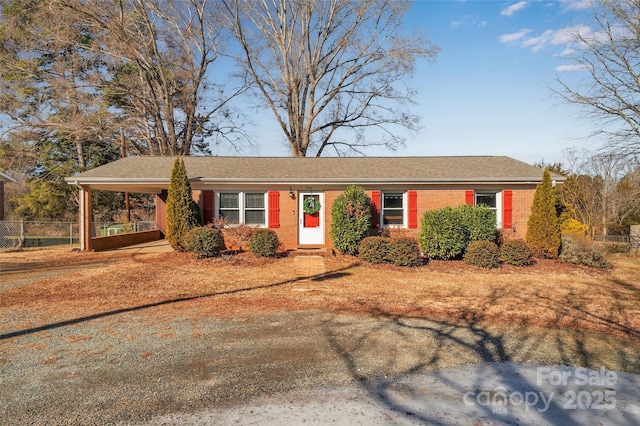 single story home featuring a carport