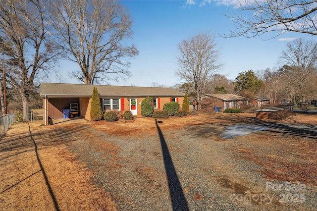 single story home with a carport