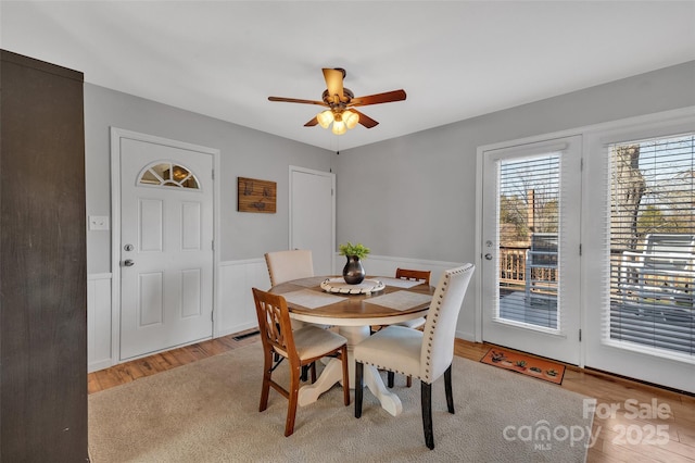 dining room featuring ceiling fan and light hardwood / wood-style flooring