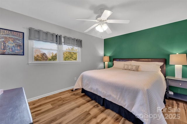 bedroom featuring ceiling fan and light hardwood / wood-style floors