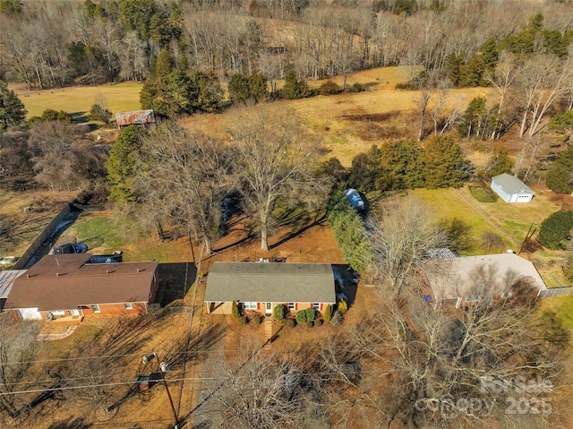 birds eye view of property with a rural view