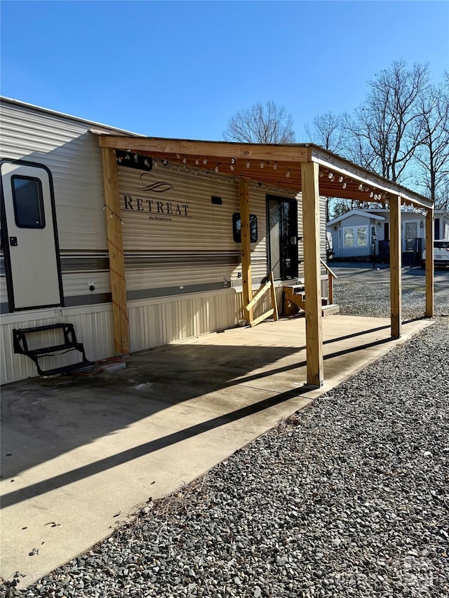 exterior space featuring a carport