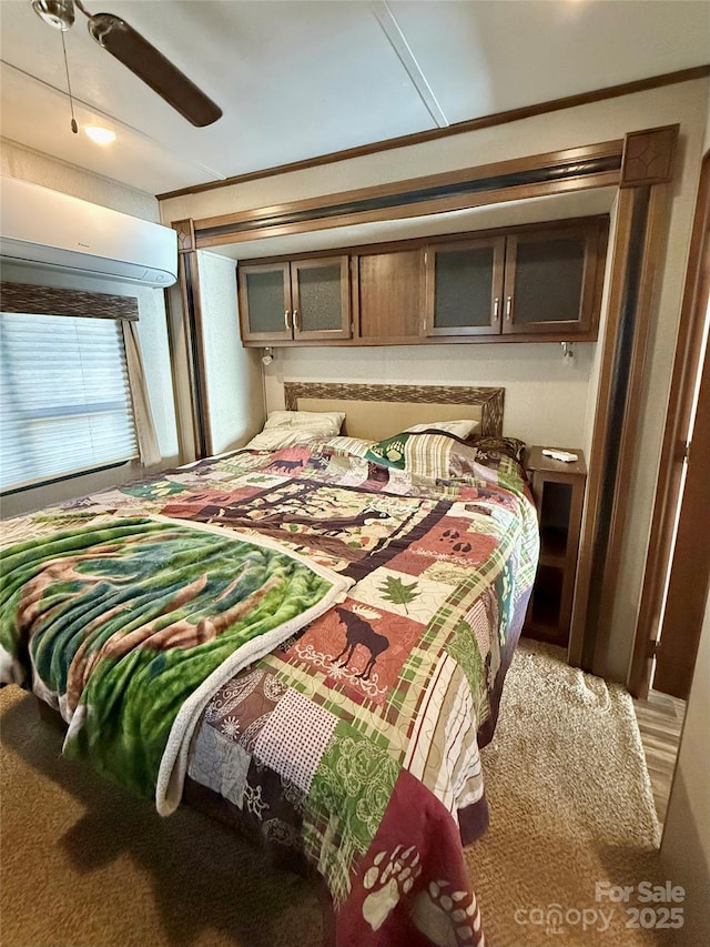 bedroom featuring ceiling fan and carpet