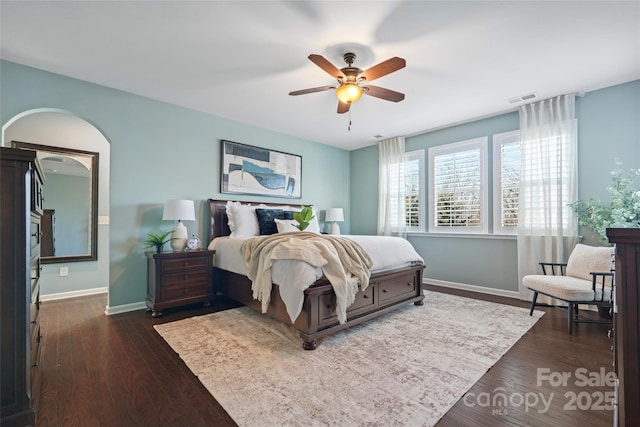 bedroom with dark wood-type flooring and ceiling fan