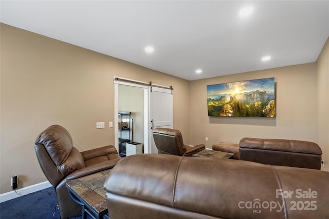 carpeted living room with a barn door