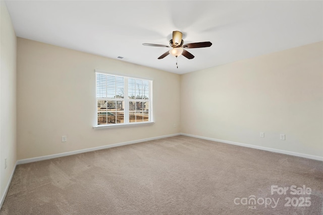 empty room with light carpet and ceiling fan