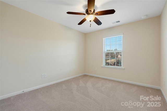 carpeted empty room with ceiling fan