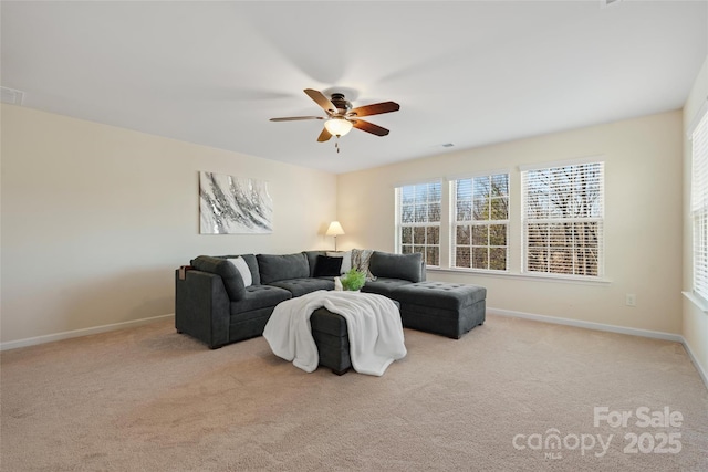 living room with ceiling fan and light colored carpet