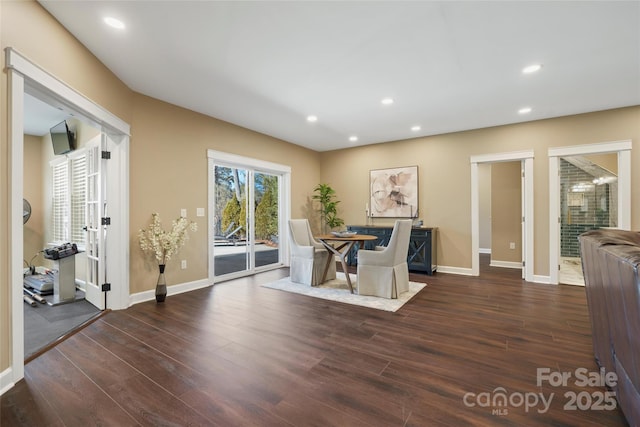 dining room with recessed lighting, baseboards, and wood finished floors