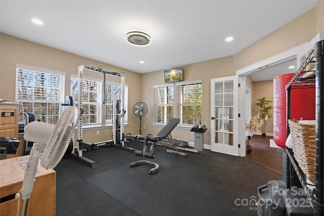 exercise room featuring recessed lighting and baseboards