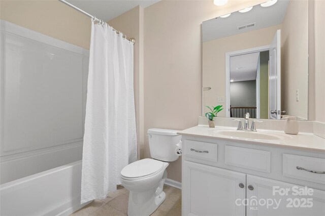 full bathroom featuring vanity, visible vents, shower / bath combo with shower curtain, tile patterned floors, and toilet