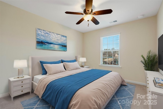 bedroom featuring visible vents, a ceiling fan, carpet, and baseboards