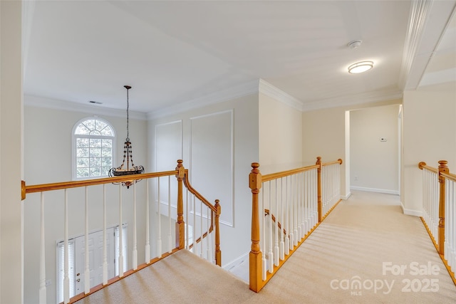 hallway featuring light carpet and crown molding