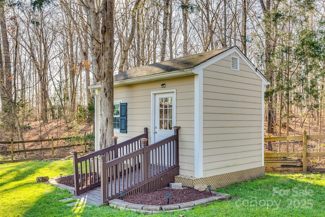 view of outbuilding featuring a yard