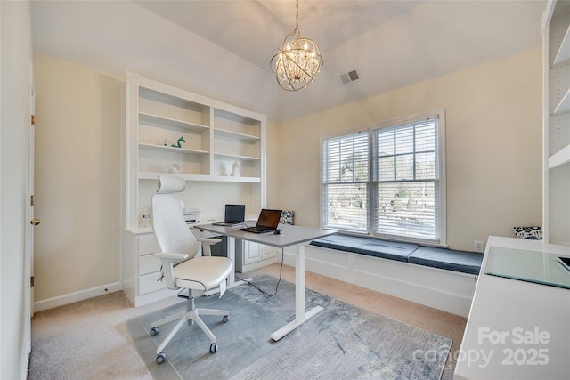 office space featuring light carpet, a chandelier, and vaulted ceiling