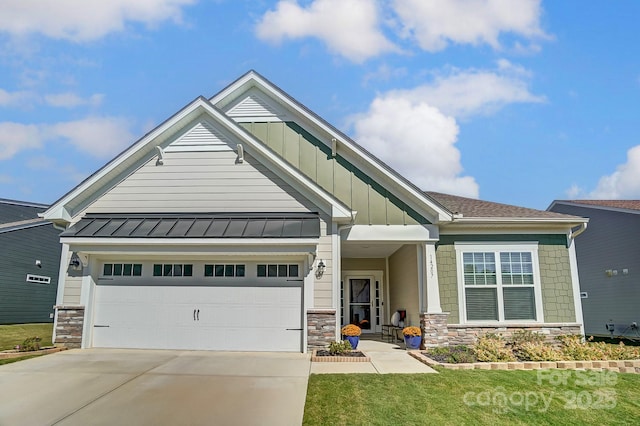 craftsman-style home with a garage and a front lawn