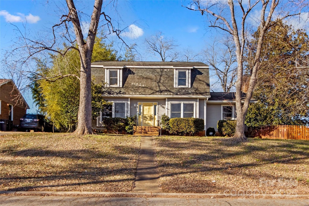 front facade with a front yard