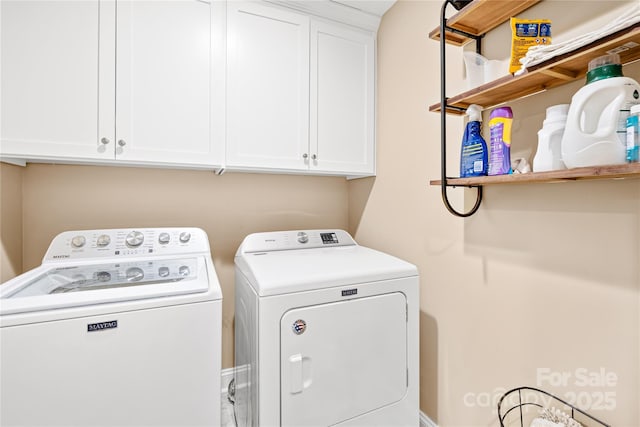 washroom with washer and dryer and cabinet space