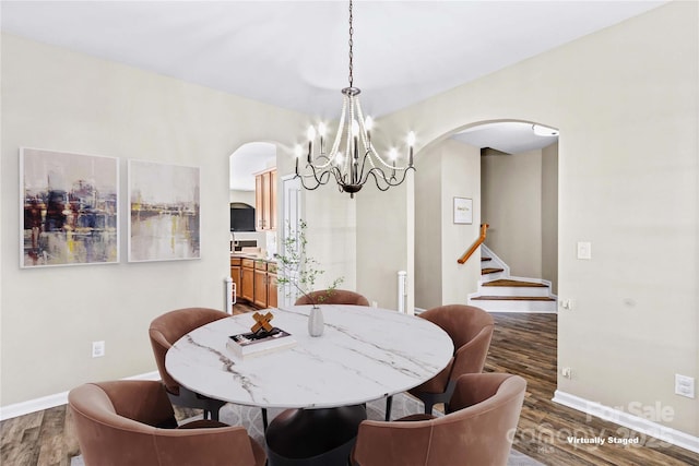 dining space with dark wood-type flooring