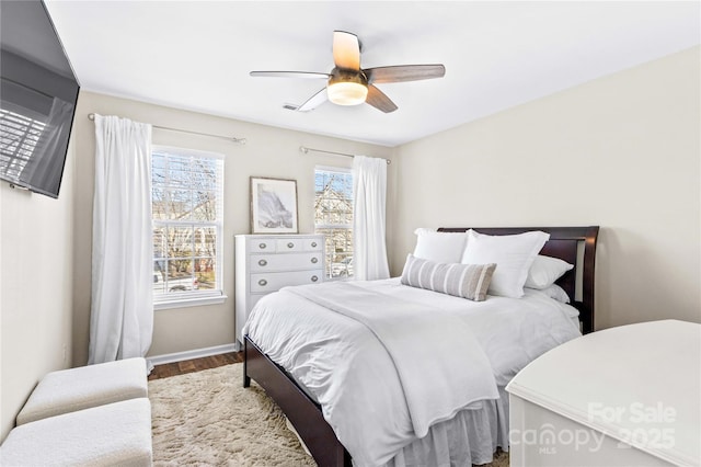 bedroom featuring ceiling fan and wood-type flooring