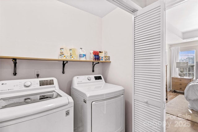 laundry room with washing machine and clothes dryer