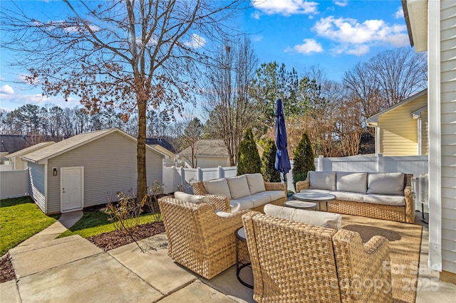 view of patio with an outdoor living space and a storage unit