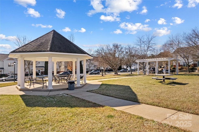 surrounding community featuring a gazebo, a yard, and a pergola