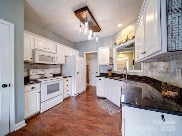 kitchen featuring white cabinetry, sink, and white appliances