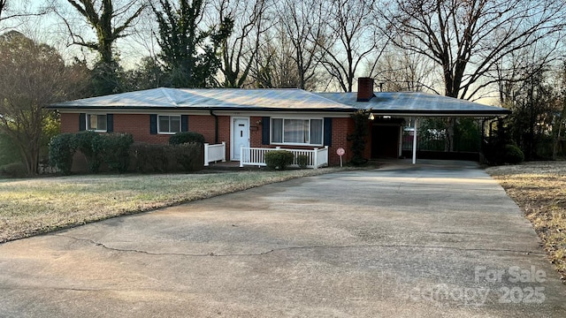 ranch-style house with a carport