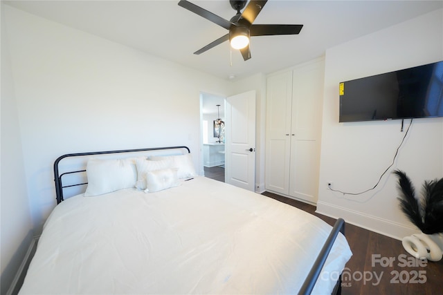 bedroom featuring ceiling fan and dark wood-type flooring