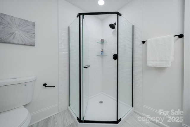 bathroom with toilet and walk in shower