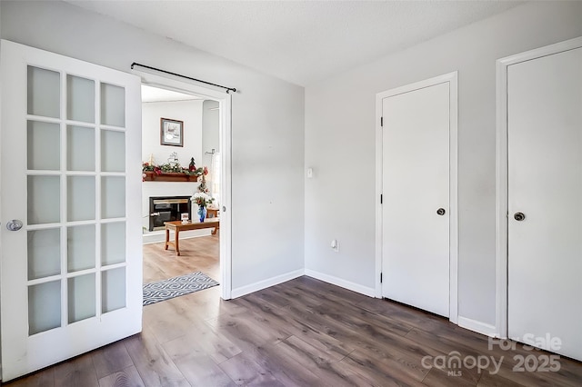 bedroom with dark hardwood / wood-style floors