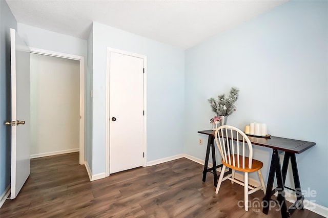 home office with dark hardwood / wood-style floors