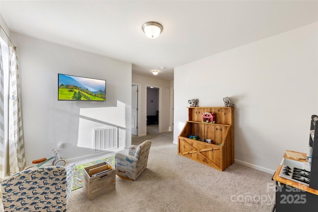 living area with carpet flooring