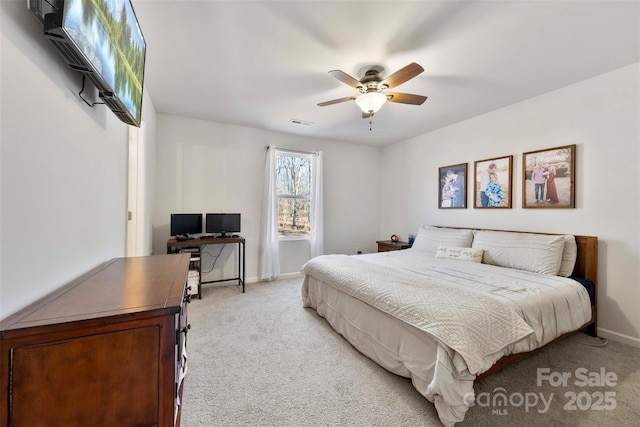 bedroom featuring ceiling fan and light colored carpet