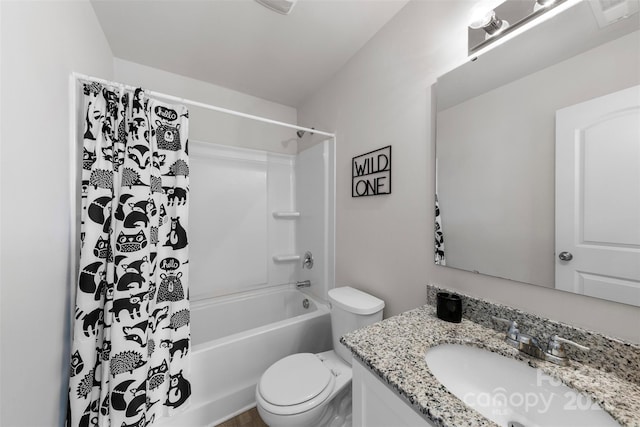 full bathroom featuring toilet, vanity, and shower / bathtub combination with curtain