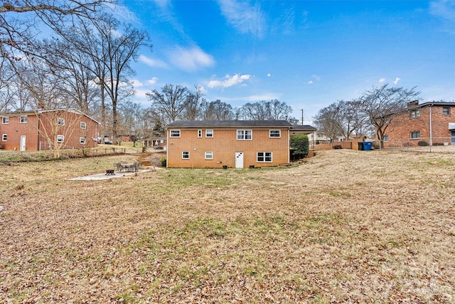 rear view of house with a yard