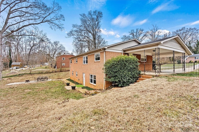 view of side of property with a lawn