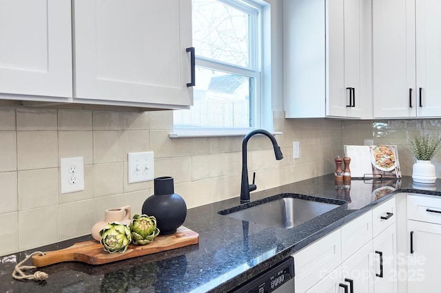 kitchen with sink, decorative backsplash, and white cabinetry