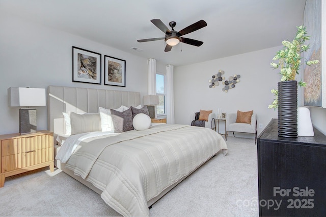 bedroom with ceiling fan and carpet flooring