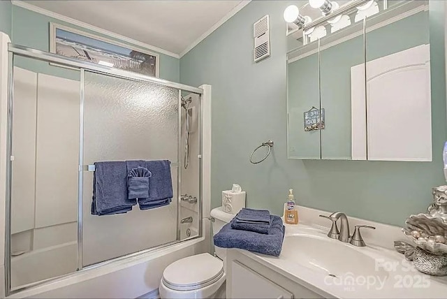 full bathroom with enclosed tub / shower combo, crown molding, vanity, and toilet