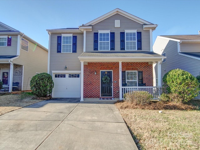 front of property with a porch and a garage